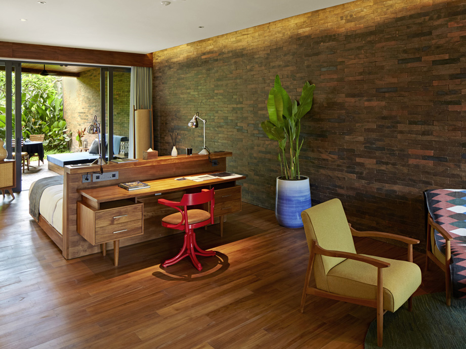 An overview of the living, sleeping and outdoor area of the luxurious Garden Suite at Potato Head Suites in Seminyak, Bali.