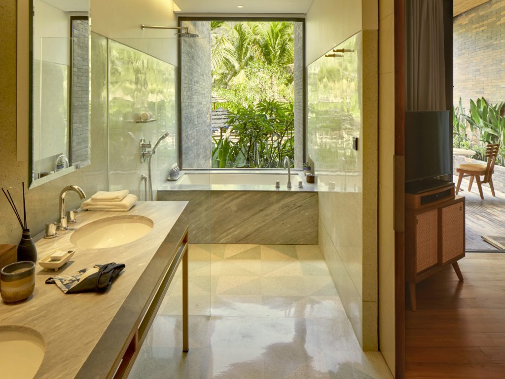 Marbled bathroom of the Island Suite at Potato Head Suites, located at Desa Potato Head in Seminyak, Bali.
