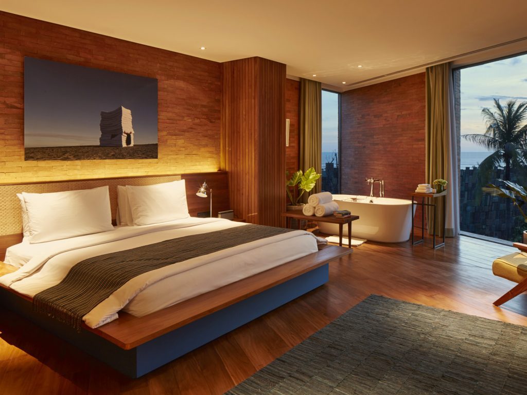The sleeping area of the luxurious Potato Head Suites at Katamama Hotel in Seminyak, Bali, features a bathtub at the corner.