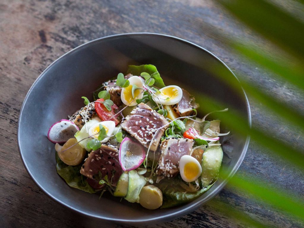 A bowl of torched sesame tuna salad served at the Potato Head Beach Club, located at Desa Potato Head in Seminyak, Bali.