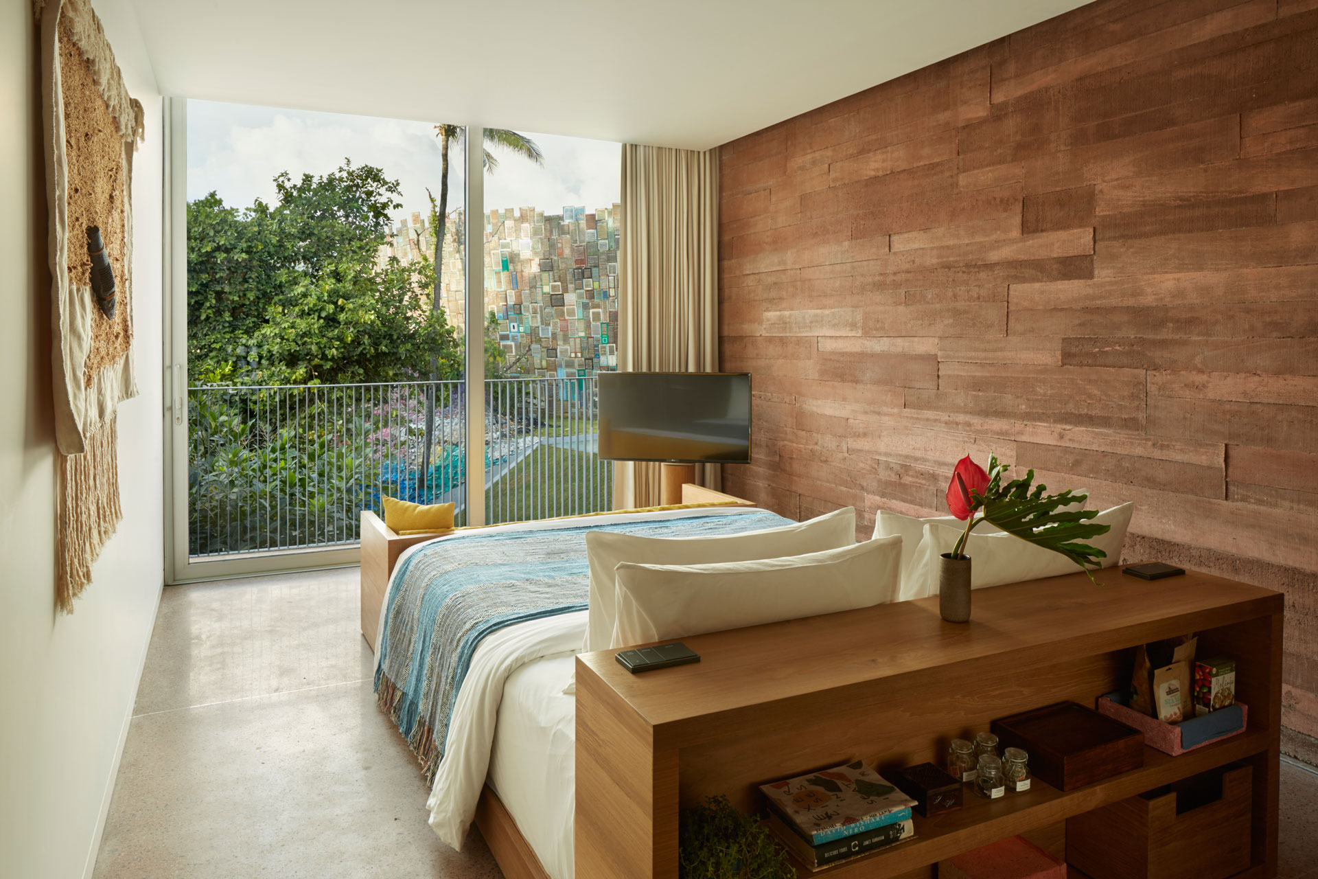The cosy sleeping area in one of the studios at the Potato Head Studios in Seminyak, Bali features the Desa view.