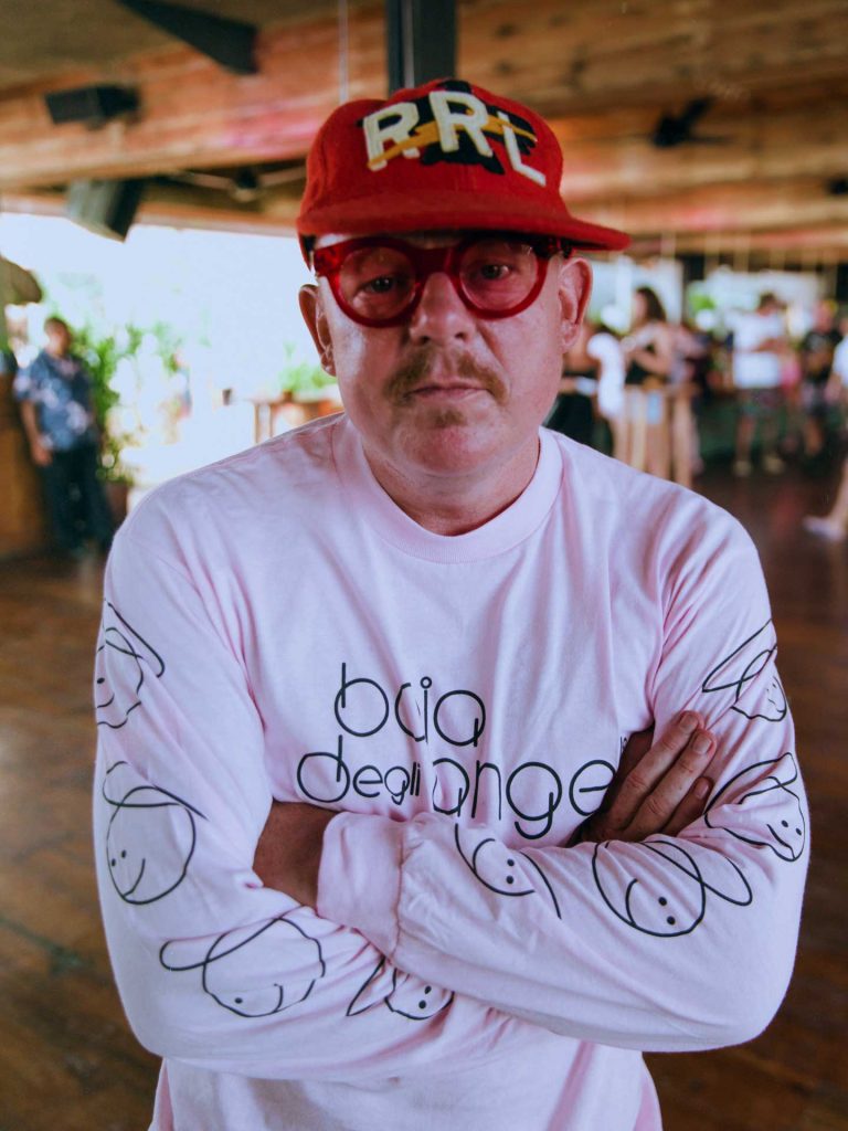 A man is wearing red cap and white t-shirt during DJ Daniele Baldelli x Junior Executive event at Desa Potato Head Seminyak, Bali.