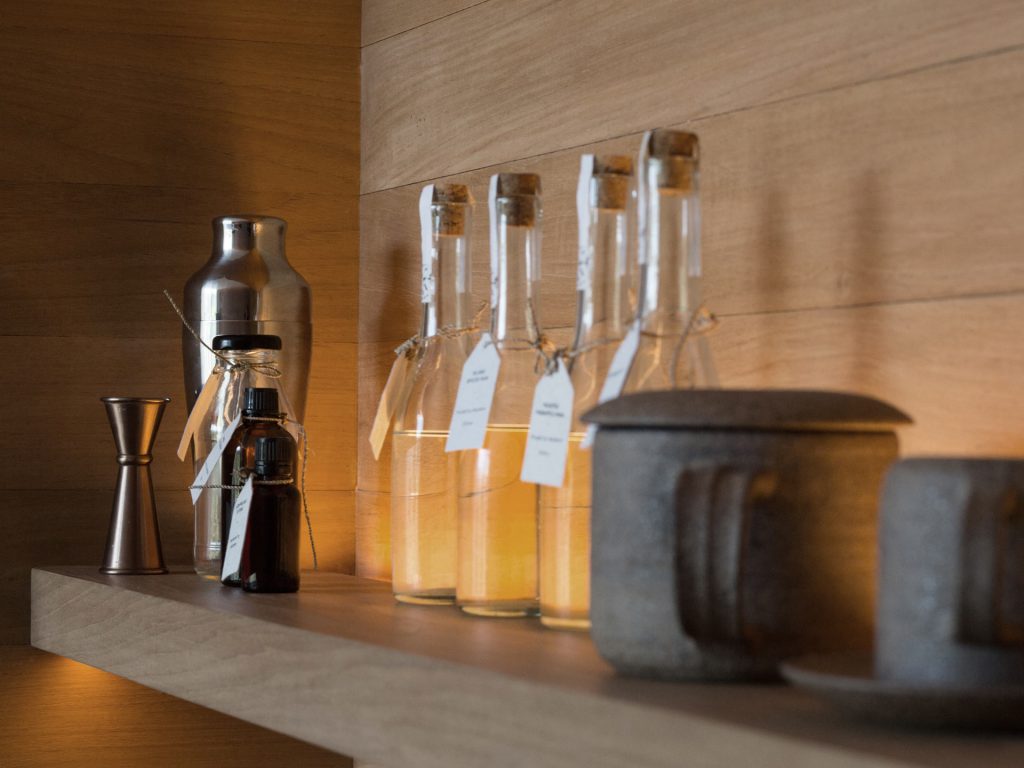 Cocktail tools and house-infused spirits offered at the in-room bar at Potato Head Studios in Seminyak, Bali.