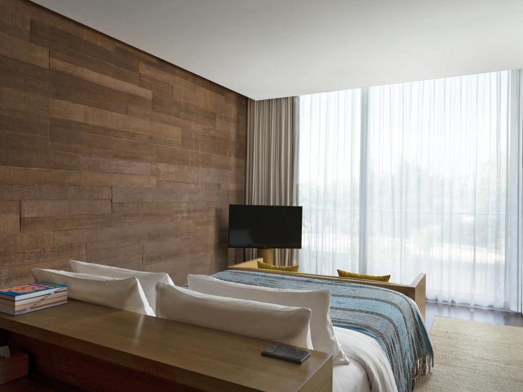 The sleeping and living area in the studios at Potato Head Studios located at Desa Potato Head in Seminyak, Bali.