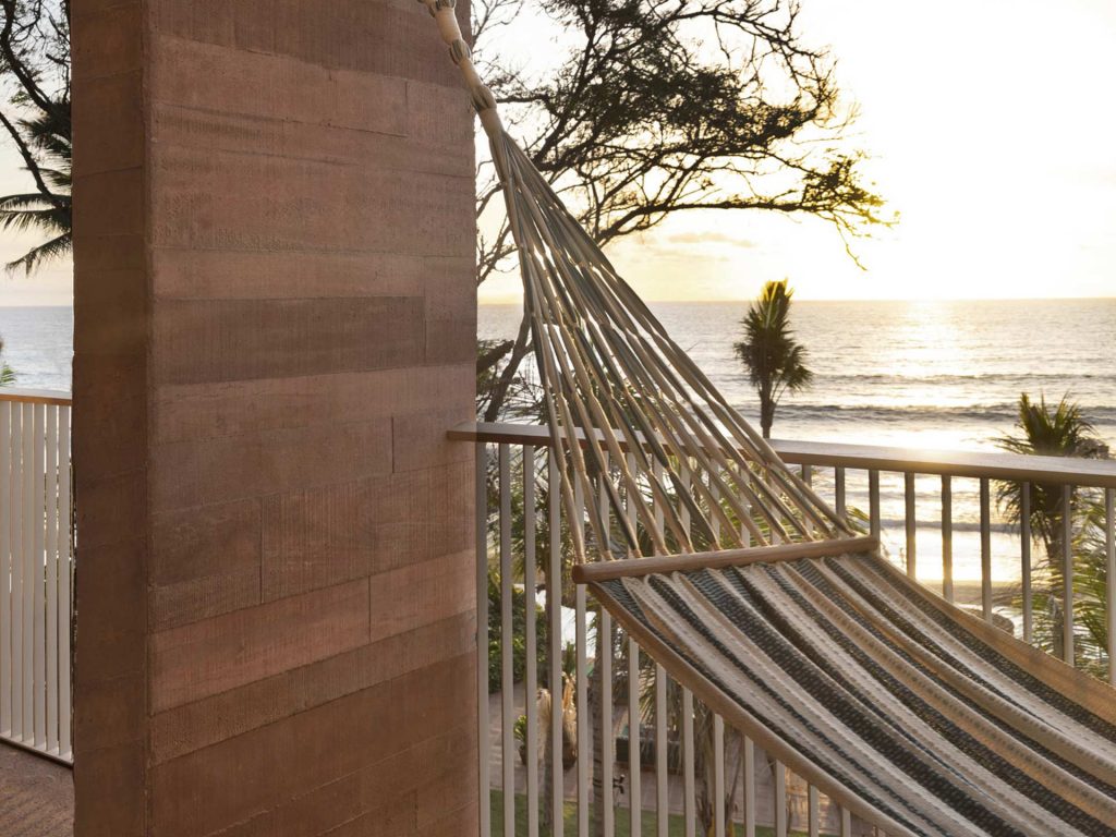 An idyllic hammock hanging in the balcony of the Oceanfront Studio at Potato Head Studios in Seminyak, Bali, 